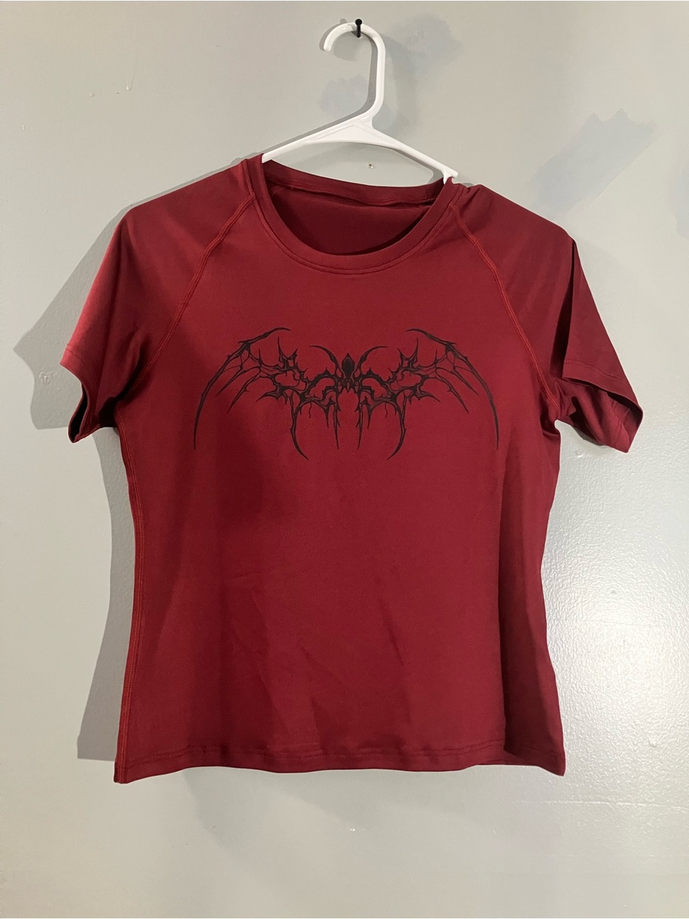 Amazon Women's Short Sleeve Burgundy Tee with Black Wing Graphic